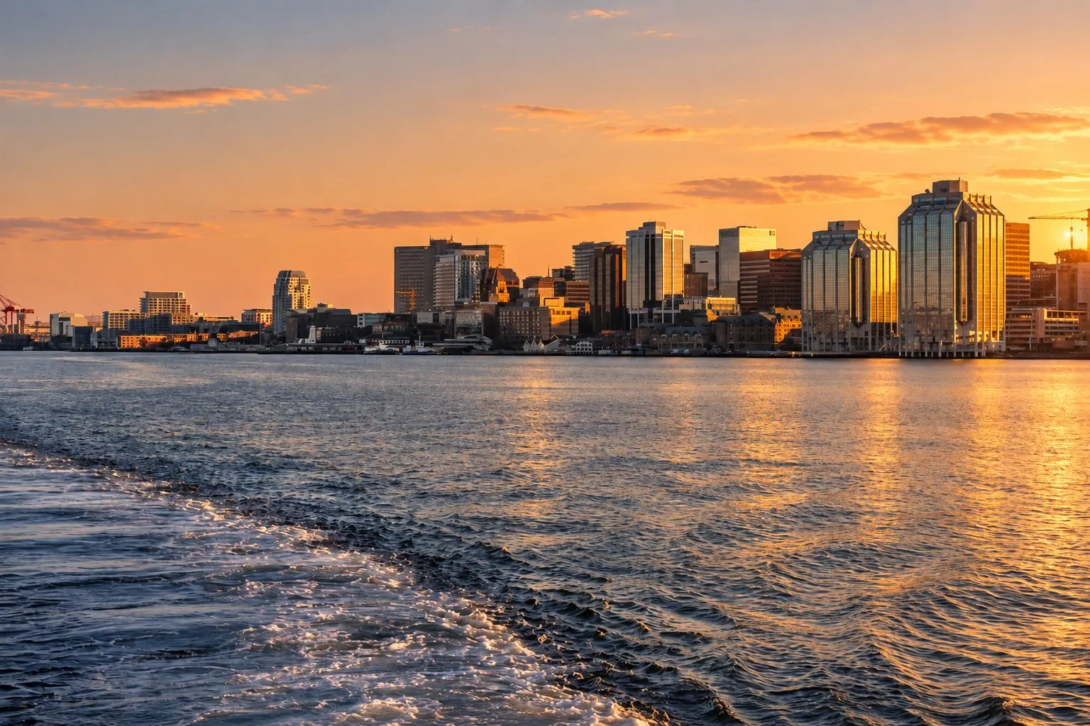 The Halifax skyline at sunset, seen across the harbour